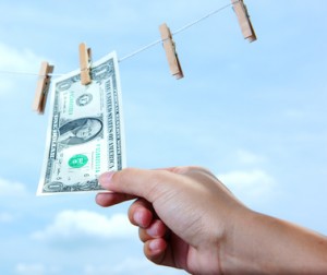 hand pull money from clothes line